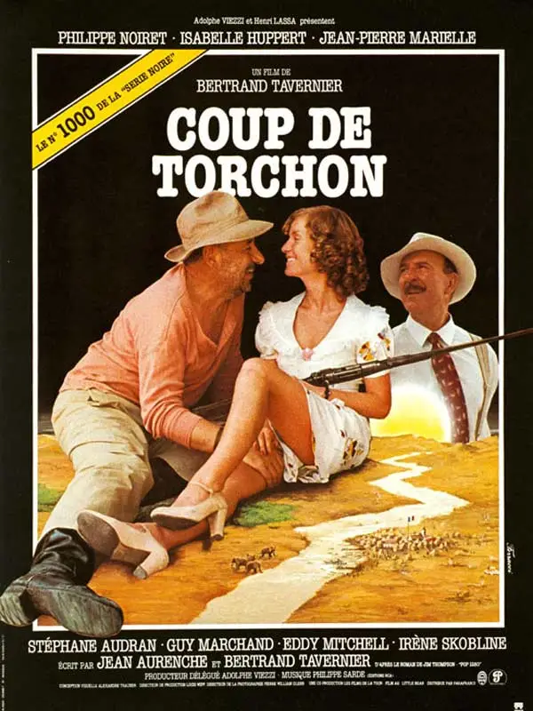 An official vintage movie poster for the French film "Coup de Torchon" shows a man in a fedora leaning towards a smiling woman in a white dress on a stylized desert landscape with a river trail.