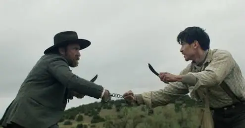 Two men fight with knives while their wrists are linked by a short chain, a scene reminiscent of a gritty thriller from the Austin Film Festival 2026.